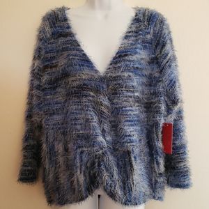 Jennifer Lopez eyelash blue knit sweater